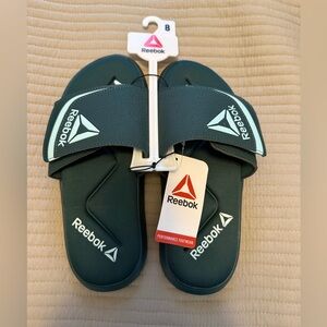NWT men’s Reebok Dark Green Slide Sandals, size 8 or can fit a women’s 9.5